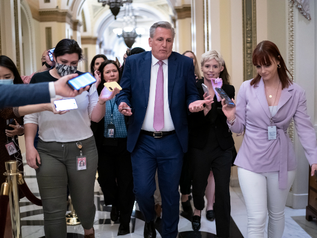 FILE - House Republican Leader Kevin McCarthy, R-Calif., rushes to his office with reporters in pursuit, at the Capitol in Washington, Thursday, May 12, 2022. The new 118th Congress, with Republicans in control of the House, begins Jan. 3, 2023, but the first task for the GOP is electing a new speaker and whether Kevin McCarthy can overcome opposition from conservative lawmakers in his own ranks to get the job. (AP Photo/J. Scott Applewhite, File)