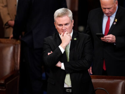 Rep. James Comer, R-Ky., stands to nominate Rep. Kevin McCarthy, R-Calif., for a 13th round of voting in the House chamber as the House meets for the fourth day to elect a speaker and convene the 118th Congress in Washington, Friday, Jan. 6, 2023. (AP Photo/Alex Brandon)