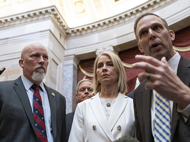 Members of the conservative freedom caucus; from left, Rep. Chip Roy, R-Texas, Rep. Mary Miller, R-Ill., Rep. Scott Perry, R-Pa., talk to reporters in Statuary Hall at the Capitol in Washington, Friday, Jan. 6, 2023. (AP Photo/Jose Luis Magana)