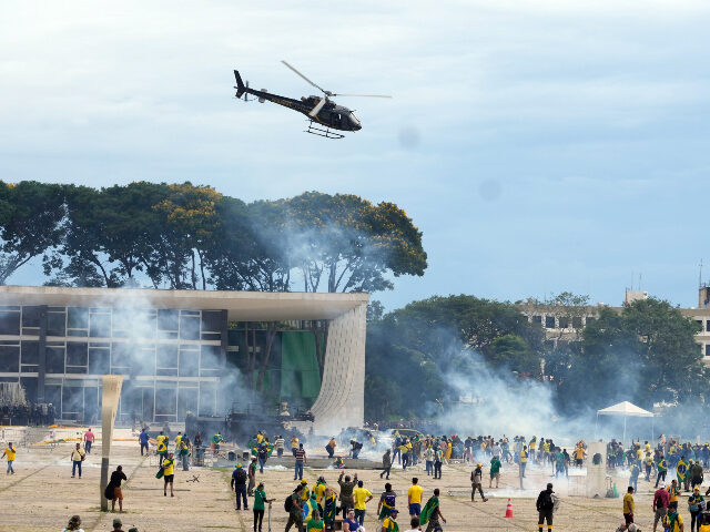 Protesters, supporters of Brazil's former President Jair Bolsonaro, clash with police as t