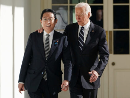 President Joe Biden and Japanese Prime Minister Fumio Kishida walk along the Colonnade of