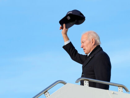President Joe Biden waves as he boards Air Force One at Moffett Federal Airfield in Mountain View, Calif., after touring storm damage Thursday, Jan 19, 2023. (AP Photo/Susan Walsh)
