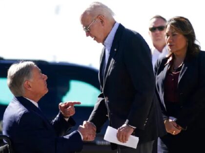 Texas Governor Greg Abbott welcomes President Joe Biden at the start of his first-ever border visit. (AP Photo/Andrew Harnik)