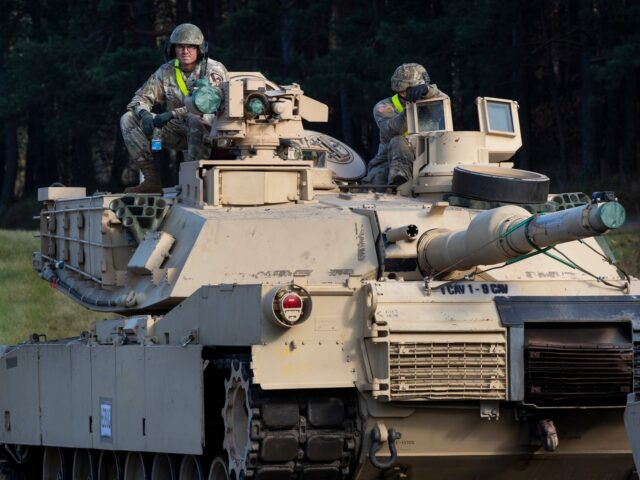 Members of the US Army's 1st Armoured Battalion of the 9th Regiment, 1st Division from Fort Hood in Texas sit on a Abrams battle tank after arriving at the Pabrade railway station some 50 km (31 miles) north of the capital Vilnius, Lithuania, Monday, Oct. 21, 2019. The U.S. military …