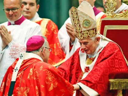 Charles Joseph Chaput, archbishop of Philadelphia, is greeted by Pope Benedict XVI after receiving the pallium, a woolen shawl symbolizing their bond to the pope, at the Vatican, Friday, June 29, 2012. (AP Photo/Andrew Medichini)
