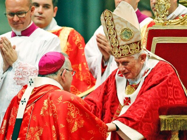 Charles Joseph Chaput, archbishop of Philadelphia, is greeted by Pope Benedict XVI after r