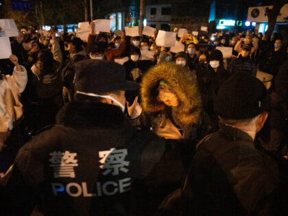 Chinese policemen face off with protesters holding up blank pieces of paper in defiance in Beijing, Sunday, Nov. 27, 2022. Street protests that broke out in several Chinese cities over the weekend may have come as a surprise, but the ruling Communist Party has been preparing for this moment for …