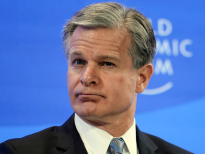 FBI Director Christopher Wray listens at the World Economic Forum in Davos, Switzerland Thursday, Jan. 19, 2023. The annual meeting of the World Economic Forum is taking place in Davos from Jan. 16 until Jan. 20, 2023. AP Photo/Markus Schreiber)