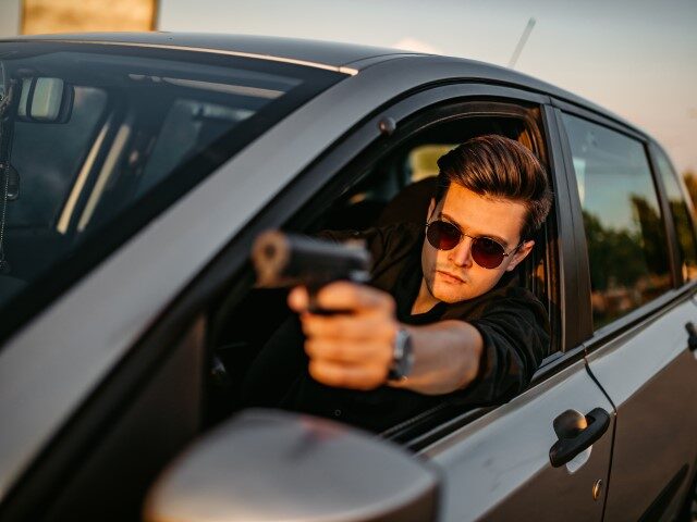 Driver with gun