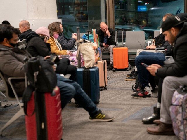 US-AVIATION-FAA-TRAVEL Travelers wait to hear if their flight will depart on time, at Los