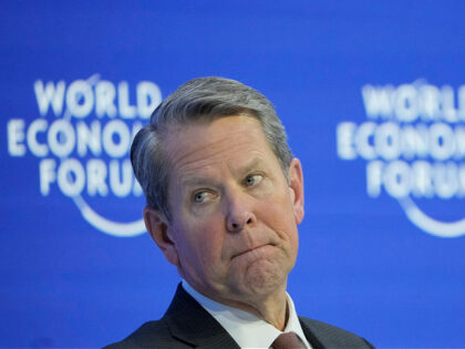 From left: US Gov. Brian Kemp of Georgia, attends a panel at the World Economic Forum in Davos, Switzerland Tuesday, Jan. 17, 2023. The annual meeting of the World Economic Forum is taking place in Davos from Jan. 16 until Jan. 20, 2023. (AP Photo/Markus Schreiber)