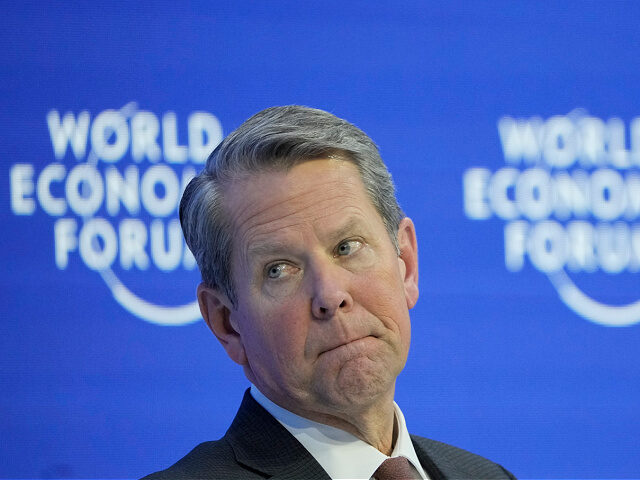 From left: US Gov. Brian Kemp of Georgia, attends a panel at the World Economic Forum in D