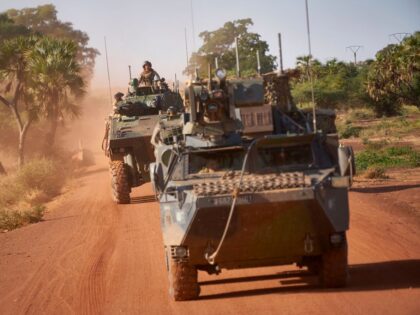 Two Armoured Personnel Carriers (APC) of the French Army patrol a rural area during the Bourgou IV operation in northern Burkina Faso on November 14, 2019. - This is the first time that the French Army, the national armies and the multinational force of the G5 Sahel (Mali, Burkina Faso, …