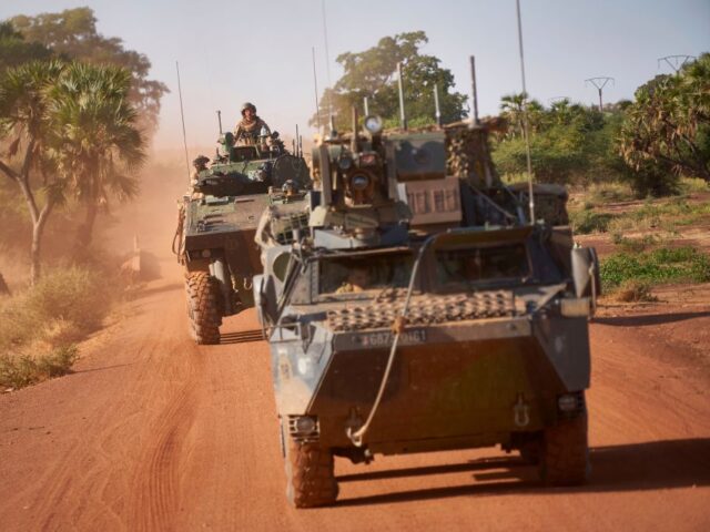 Two Armoured Personnel Carriers (APC) of the French Army patrol a rural area during the B