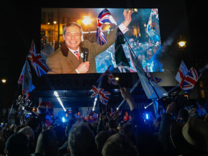 Revelers react as Nigel Farage, leader of the Brexit Party, delivers a speech during the "Leave Means Leave" celebration at Parliament Square in London, U.K., on Friday, Jan. 31, 2020. After more than three years of bickering and political gridlock the U.K. is scheduled to leave the European Union, ushering …