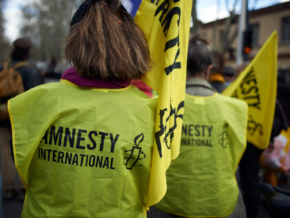 Activists of Amnesty International during the protest. Protesters protested against the 'Global Security Law' bill promoted by French President Macron and his majority. The protest was called by several NGOs such as Amnesty International, Human Rights League and by several unions (FO, SNJ [National Union of Journalists], CNt, etc.) The …