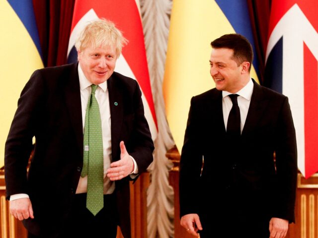 British Prime Minister Boris Johnson (L) is welcomed by Ukraine's President Volodymyr Zelensky at the Presidential Palace, in Kyiv on February 1, 2022. - Ukrainian President Volodymyr Zelensky on February 1, 2022 said Western military and diplomatic support had reached it highest level since the year Crimea was annexed, as …