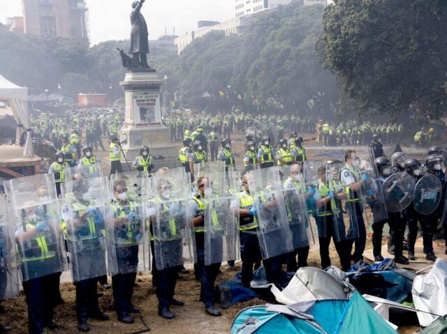 Police move in to clear protesters from Parliament grounds in Wellington on March 2, 2022, on day twenty three of demonstrations against Covid-19 vaccine mandates and restrictions. (Photo by Marty MELVILLE / AFP) (Photo by MARTY MELVILLE/AFP via Getty Images)