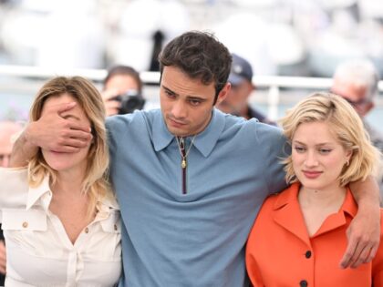 Italian-French director Valeria Bruni Tedeschi (L), French actress Nadia Tereszkiewicz (R) and Sofiane Bennacer (C) pose during a photocall for the film âForever Young (Les Amandiers)â at the 75th annual Cannes Film Festival in Cannes, France on May 23, 2022. (Photo by Mustafa Yalcin/Anadolu Agency via Getty Images)
