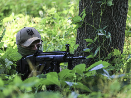 KHARKIV, UKRAINE - JUNE 13: A member of Ukrainian special operations team is seen during the military tactical training at a woodland in Kharkiv, Ukraine on June 13, 2022. Special operations teams of the Ukrainian Armed Forces serving in Kharkiv conduct continuous war readiness training as Russia - Ukraine war …