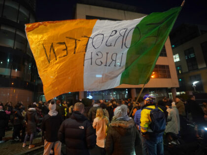 Members of the public march on Dublin Port following the housing of some 100 migrants at t
