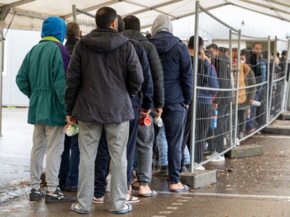PRODUCTION - 16 November 2022, Baden-Wuerttemberg, Ellwangen: Refugees wait in line in front of the food counter at the state's initial reception center (LEA). If the city has its way, the LEA will be closed by the end of 2022. Photo: Stefan Puchner/dpa (Photo by Stefan Puchner/picture alliance via Getty …