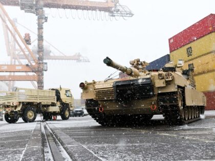 A M1A2 Abrams battle tank of the US army that will be used for military exercises by the 2nd Armored Brigade Combat Team, is unloaded at the Baltic Container Terminal in Gdynia on December 3, 2022. - The military equipment arrived in Poland as part of the Operation Atlantic Resolve, …