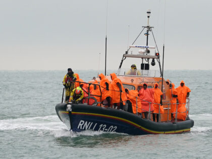 A group of people thought to be migrants are brought in to Dungeness, Kent, after being re