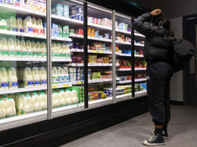 A shopper buys milk at the recently opened Asda Express convenience store, operated by Asda Group Ltd., in London, UK, on Tuesday, Dec. 13, 2022. Asda is accelerating its push into convenience stores as the UK's third-largest supermarket operator seeks to expand its market share. Photographer: Hollie Adams/Bloomberg via Getty …