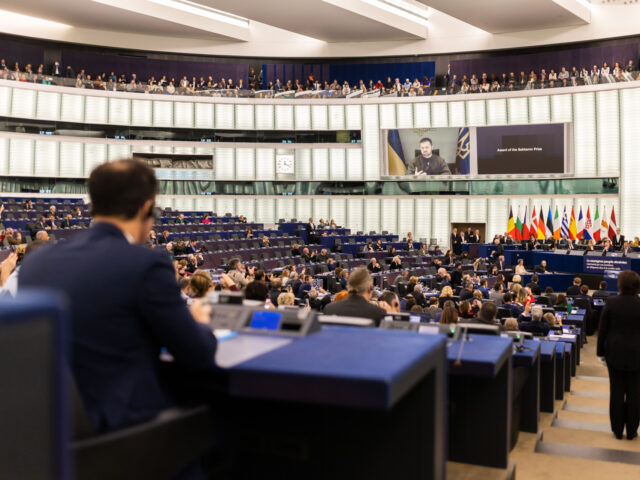 14 December 2022, France, Straßburg: Ukrainian President Volodymyr Selenskyj speaks live to visitors and members of the European Parliament during the Sakharov Prize ceremony. The European Parliament will today award the Sakharov Prize to the Ukrainian people and vote on financial aid of nearly 720 million euros for seven EU …