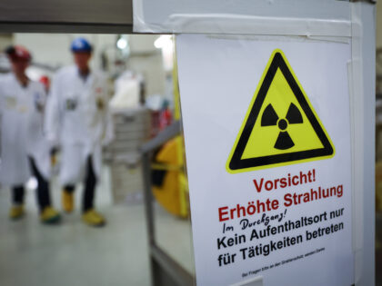 19 December 2022, Schleswig-Holstein, Brunsbüttel: A sign with the inscription "Caution! Increased radiation" is stuck to a passageway during a press tour of the reactor building at the Brunsbüttel nuclear power plant (KKB). The dismantling of the Brunsbüttel nuclear power plant in Schleswig-Holstein is making progress. The reactor has been …