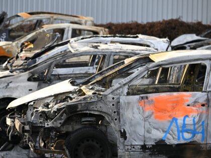 A photograph taken on January 1, 2023 shows cars which have been burnt during the New Year's eve and collected by municipal workers in the city overnight, at a car junkyard in Strasbourg, eastern France. - There were 20% fewer cars burnt than last year on New Year's Eve 2023, …