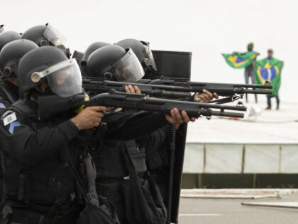 BRASILIA, BRAZIL - JANUARY 08: Supporters of former President Jair Bolsonaro clash with security forces as they raid the National Congress in Brasilia, Brazil, 08 January 2023. Groups shouting slogans demanding intervention from the army broke through the police barrier and entered the Congress building, according to local media. Police …