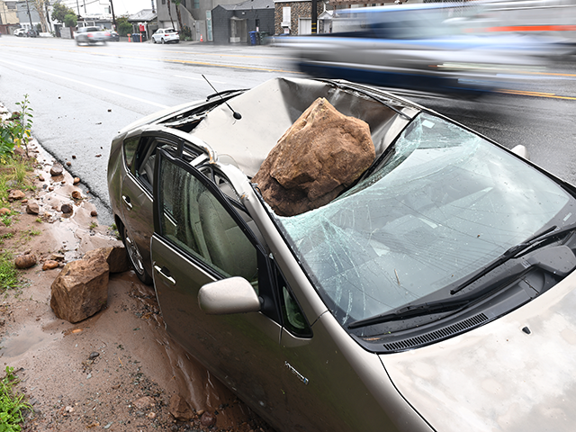 Malibu California January 10, 2023-A boulder crashed on top of a parked car along P.C.H. i