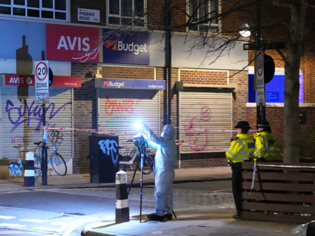 LONDON, ENGLAND - JANUARY 14: Police forensic officers attend the scene of a shooting by S
