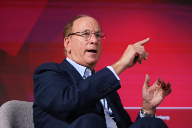 Larry Fink, chairman and chief executive officer of BlackRock, speaks at event on the side