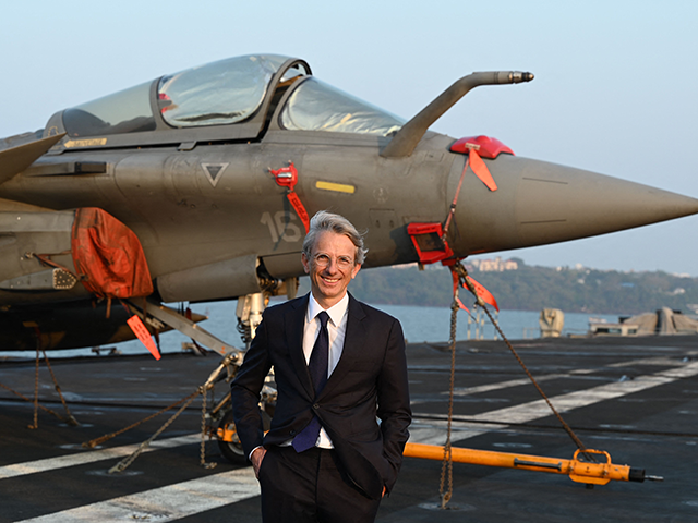 Ambassador of France to India Emmanuel Lenain stands in front of a Rafale Fighter jet on the deck of the French aircraft carrier Charles de Gaulle during the Indo-French joint naval exercise Varuna at Mormugao harbour in India's Goa state on January 21, 2023. (Photo by Sajjad HUSSAIN / AFP) …