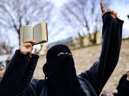 A protester holds a Koran in front of the Consulate General of Sweden in Istanbul on January 22, 2023, after Rasmus Paludan, leader of Danish far-right political party Hard Line and who also has Swedish citizenship burned a copy of the Koran near the Turkish Embassy in Stockholm. - Sweden's …