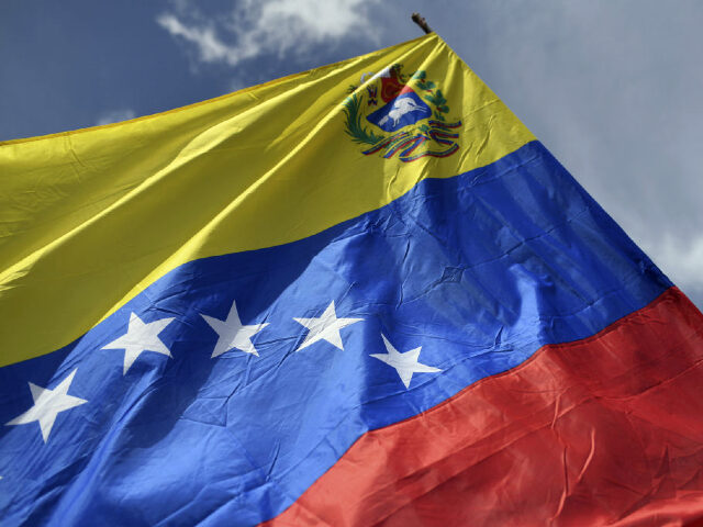 A Venezuelan flag during a pro-government rally in protest against US sanctions in Caracas, Venezuela, on Monday, Jan. 23, 2023. The US State Department said that they will continue to enforce the sanctions program against the Maduro regime until the Venezuelan people can achieve their democratic aspirations. Photographer: Carlos Becerra/Bloomberg …