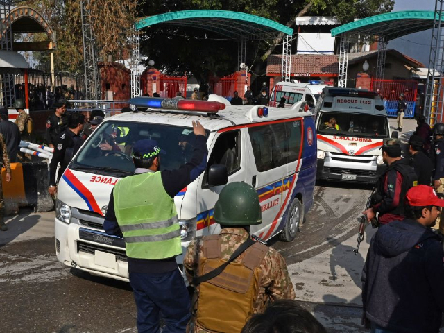Security personnel make way for ambulances carrying injured blast victims outside the police headquarters in Peshawar on January 30, 2023. - At least 25 people were killed and 120 were injured in a mosque blast at a police headquarters in Pakistan on January 30, a local government official said. (Photo by Abdul MAJEED / AFP) (Photo by ABDUL MAJEED/AFP via Getty Images)