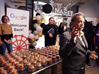 CHICAGO, ILLINOIS - APRIL 05: Chicago Mayor Lori Lightfoot greets employees returning to work at the Chicago Google offices on April 05, 2022 in Chicago, Illinois. Google employees began returning to work in the office this week for three days a week following a two-year hiatus caused by the COVID-19 …