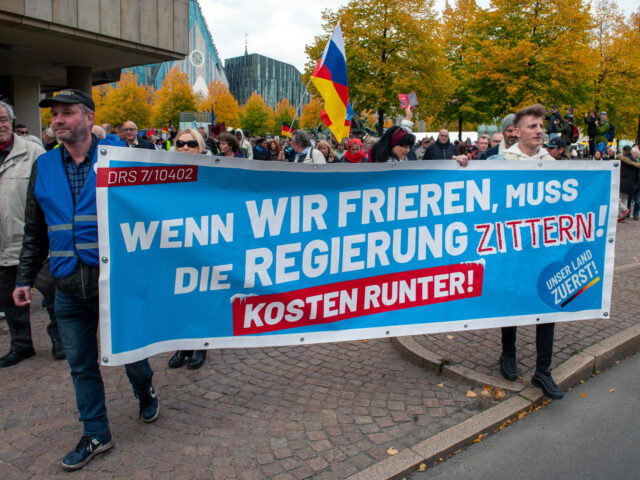 LEIPZIG,GERMANY-OCTOBER 03: Protester's at a demonstration against high energy prices and German foreign policy over the conflict in Ukraine carry a banner stating 'When we freeze the government must shiver. Costs down' at Augustusplatz in Leipzig, Saxony, Germany on October 03, 2022. (Photo by Craig Stennett/Getty Images)
