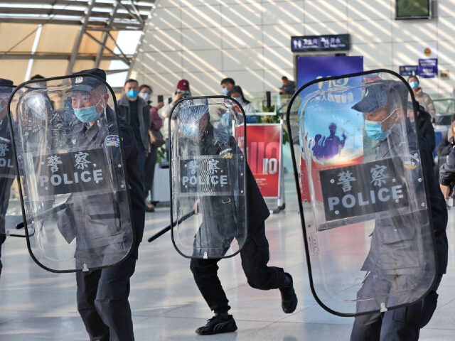 NANTONG, CHINA - JANUARY 09: Police officers perform drills during a demonstration at Nantong Railway Station one day before the 3rd Chinese People's Police Day on January 9, 2022 in Nantong, Jiangsu Province of China. (Photo by Xu Congjun/VCG via Getty Images)