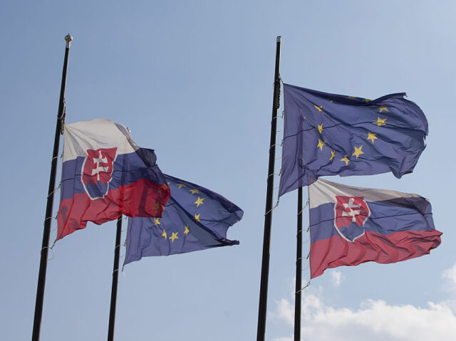 National flags of Slovakia and European Union (EU) flags fly outside Bratislava castle, th