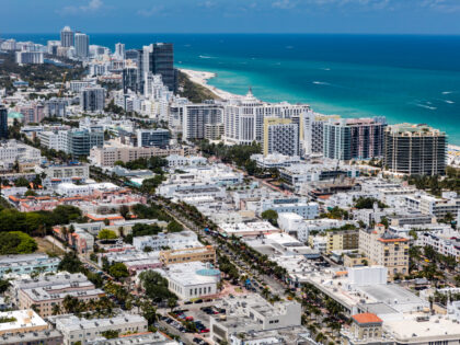 Aerial view looking East over ocean of South Beach Miami Florida cityscape with buildings