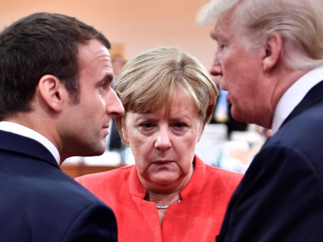 TOPSHOT - (L-R) French President Emmanuel Macron, German Chancellor Angela Merkel and US President Donald Trump confer at the start of the first working session of the G20 meeting in Hamburg, northern Germany, on July 7. - Leaders of the world's top economies will gather from July 7 to 8, …