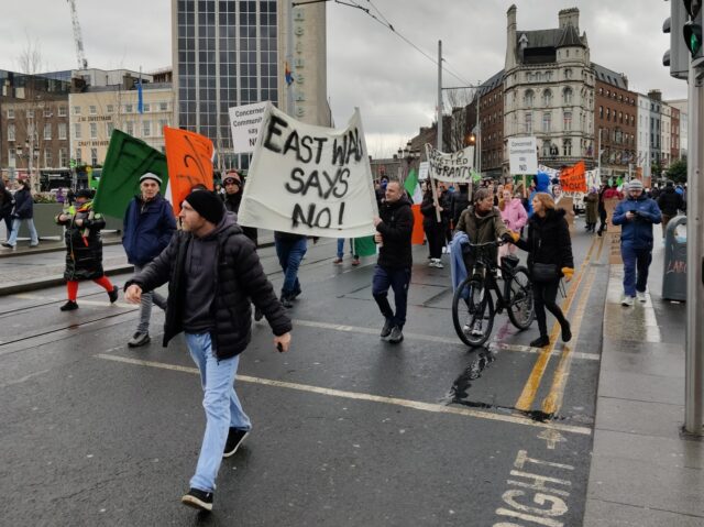 Protesters march across OConnell Bridge as part of the Dublin Says No mass immigration protest. Credit: Peter Caddle
