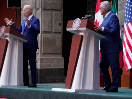 President Joe Biden speaks as Mexican President Andres Manuel Lopez Obrador listens during a news conference with Canadian Prime Minister Justin Trudeau at the 10th North American Leaders' Summit at the National Palace in Mexico City, Tuesday, Jan. 10, 2023. (AP Photo/Andrew Harnik)