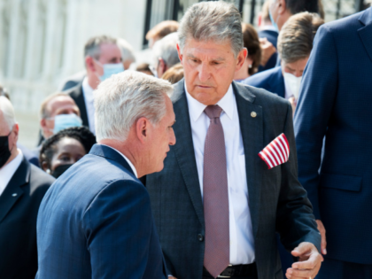 UNITED STATES - SEPTEMBER 13: Sen. Joe Manchin, D-W.Va., center, and House Minority Leader Kevin McCarthy, R-Calif., talk after a in a remembrance ceremony on the east front steps of the U.S. Capitol for the 20th anniversary of the 9/11 terrorist attacks on Monday, September 13, 2021. (Photo By Tom …