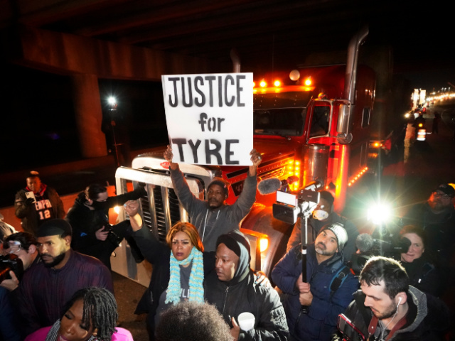 Protesters march down the street Friday, Jan. 27, 2023, in Memphis, Tenn., as authorities release police video depicting five Memphis officers beating Tyre Nichols, whose death resulted in murder charges and provoked outrage at the country's latest instance of police brutality. (AP Photo/Gerald Herbert)